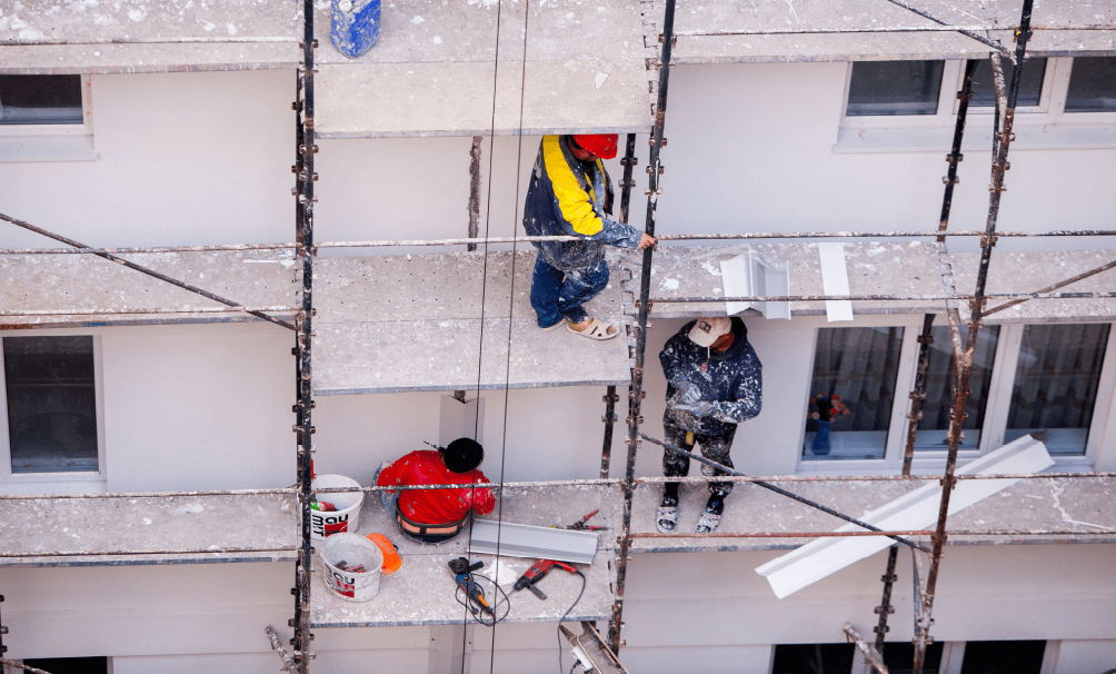 workers standing on scaffold